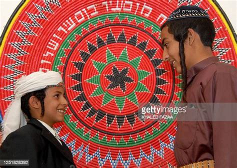 Yemeni Jews Barukh Annaati And His Older Brother Yahia Enjoy A Light