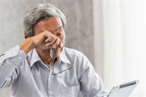 Premium Photo Asian Elderly Eye Irritation Problem Fatigue And Tired