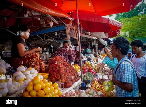 Vendors Sell Colourful Fresh Produce In A Street Market In Yangon