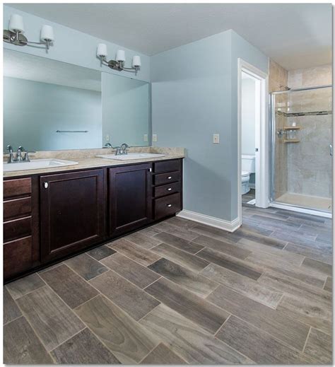 The color itself has become a huge trend due to its versatility, so much so that it is now taking a. Master bathroom with custom tiled shower and wood look ...