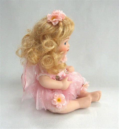 Porcelain Baby Girl Doll Curly Blonde Hair Pink Outfit Blue Eyes Delton
