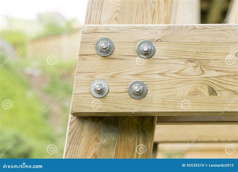 Closeup Detail Of New Wooden Beams Fastened With Bolts Stock Photo