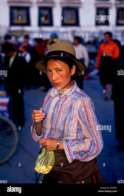 Tibetan People Pilgrim On Circumambulation Route In Front Of Jokhang