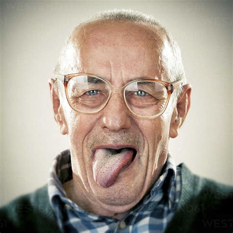 Portrait Of An Elderly Man Sticking His Tongue Out Zocf00175