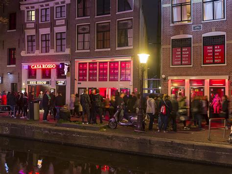amsterdam to move red light district to new ‘erotic centre outside the city in tourism overhaul
