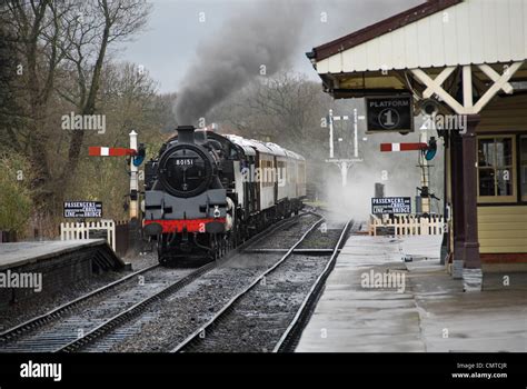 Steam Locomotive Pulling Into Railway Station At Bluebell Heritage