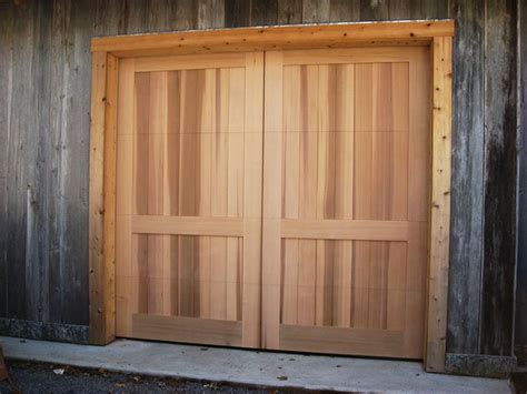 New garage doors, openers & same day repair. Country barn door, 10 feet wide and nine feet high in a ...