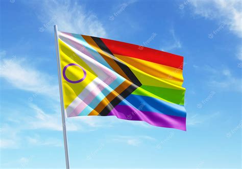 Premium Photo Progress Pride With Intersex Inclusion Rainbow Flag Waving In A Blue Sky For