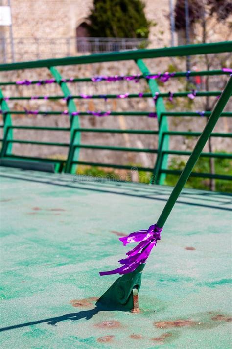 pieces of purple cloth tied to a bridge on international women`s day horizontal photo editorial