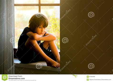 Sad Child Boy Sitting On A Window Shield Stock Image Image Of Pain