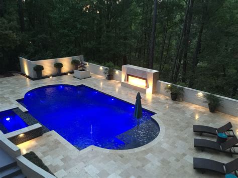 Grecian Shaped Gunite Swimming Pool With A Spillover Spa Tanning Ledge