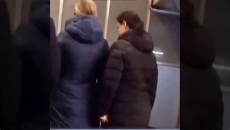 Whoa Woman Tries To Push Another Woman Onto The Train Tracks While Train Is Arriving