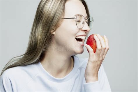 Laughing Young Girl Eating An Apple Close Up Stock Photo Image Of