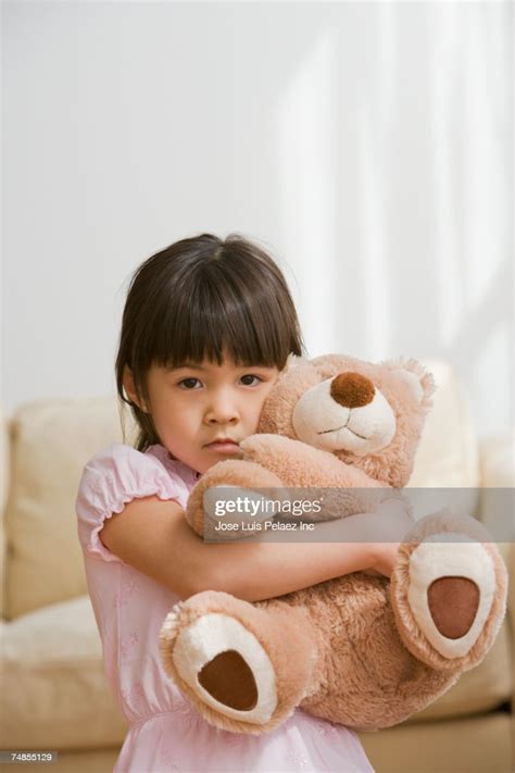 Asian Girl Hugging Teddy Bear High Res Stock Photo Getty Images