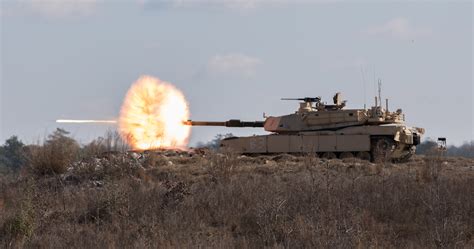 Soldiers Fire The Main Gun Of An M1a2 Abrams Tank During An Exercise At