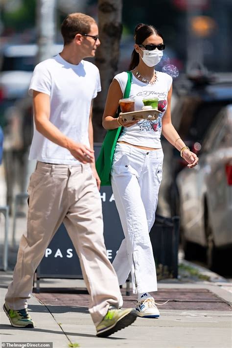 Bella Hadid embraces 2000s vibes donning an Ed Hardy tee during coffee