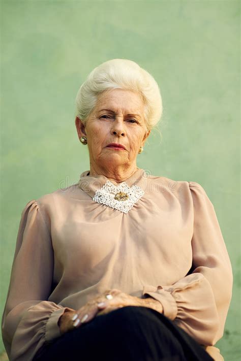 Portrait Of Serious Old Caucasian Woman Looking At Camera Stock Image