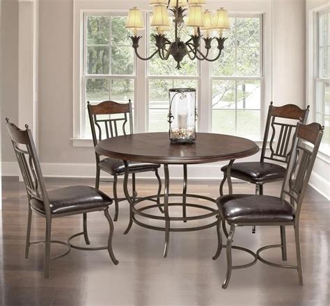 Merge formal and contemporary elements with a table featuring rich walnut and cherry surrounding framing and chocolate leather seats. Midland 5-Piece Metal/Wood Round Dining Table Set ...