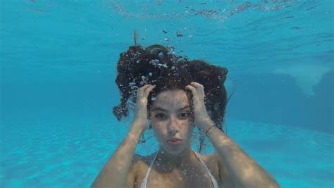 Beautiful Slim Girl In A White Bikini Swimming Under Clear Water Stock Video Footage Dissolve