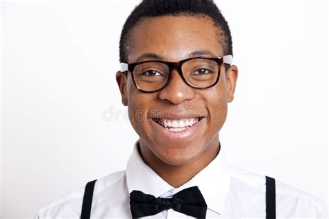 Portrait Of Young Man Wearing Eyeglasses Against White Background Stock