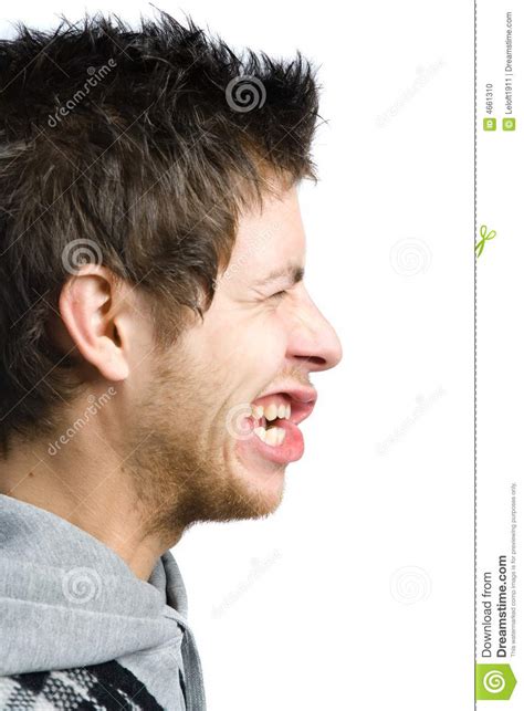 Side Profile Of Young Male Making A Funny Face Stock Photo
