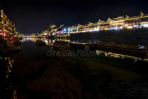 View Of Illuminated At Night Riverside Houses In Ancient Town Of