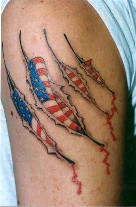 Ripped american flag shoulder tattoo. nice-ripped-skin-american-flag-tattoo-for-men-upper-arm ...