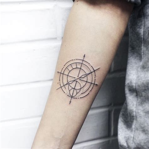 Linear Minimalist Compass Tattoo On The Right Forearm Compass Tattoo