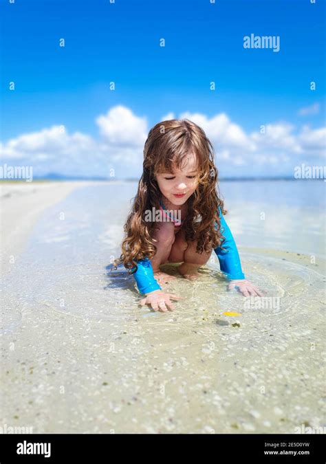 Girl Playing In Shallow Water On Beach Rio De Janeiro Brazil Stock Photo Alamy