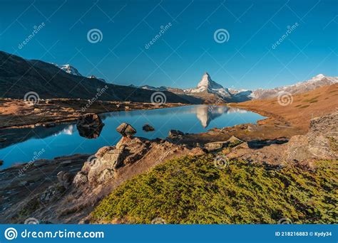Panoramic Morning View Of Lake Stellisee With The Matterhorn Cervino