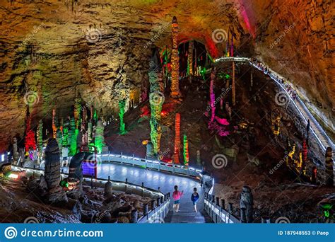 People Sightseeing Interior Of Magnificent Huanglong Yellow Dragon Cave