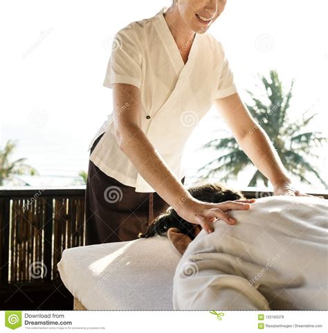 Female Massage Therapist Giving A Massage At A Spa Stock Image Image