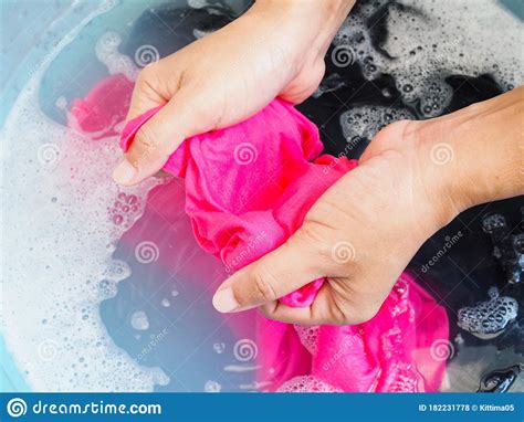 Wash Color Clothes With Hand And Soak Cloth In Laundry Detergent Water