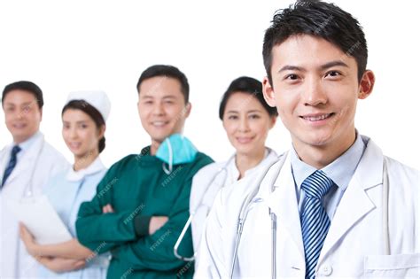 Premium Photo Portrait Of Happy Male Doctor With Medical Team In