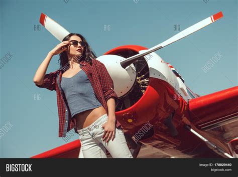 Sexy Woman With Plane Telegraph