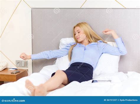 Happy Businesswoman Lying In Bed In Hotel Room Stock Image Image