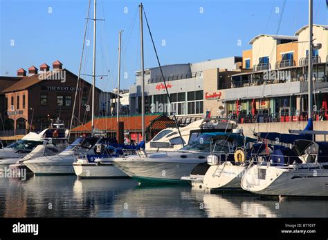 Sailing Boats And Restaurants In Brighton Marina England Stock Photo