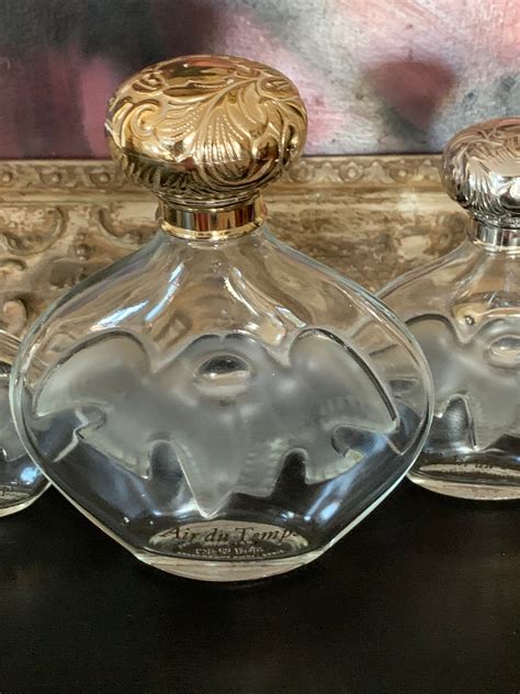 Three Graduating In Size Vintage Lalique Designed Perfume Bottles By