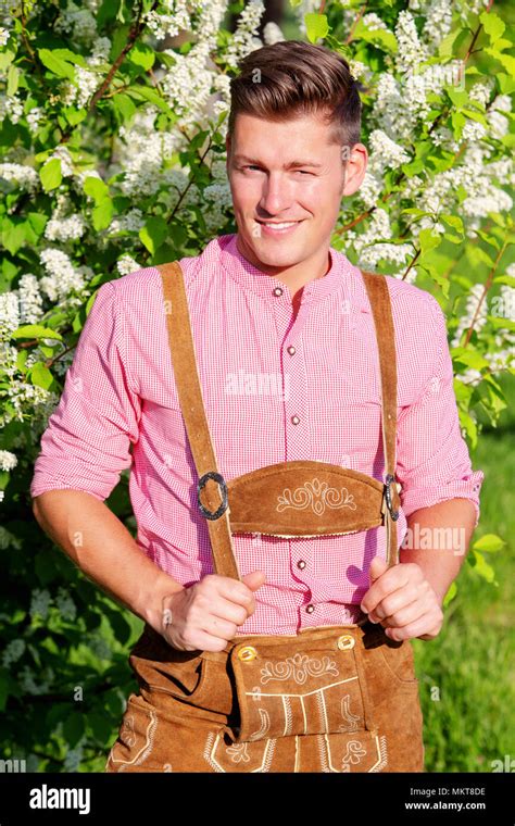 Portrait Of Handsome Bavarian Blond Man Standing Outdoors Stock Photo