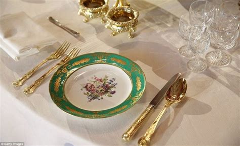 The Table Is Set With Gold And Green China