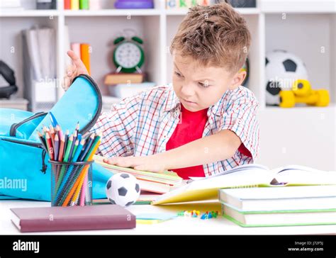 Boy Doing Homework Stock Photo Alamy