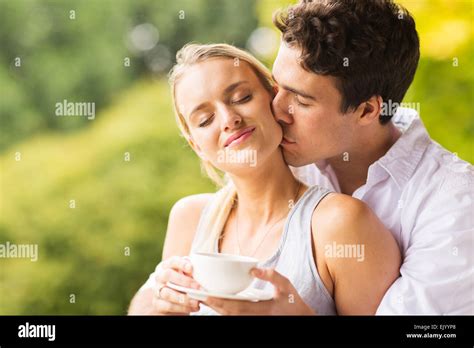 Handsome Husband Kissing Wife Outdoors Stock Photo Alamy
