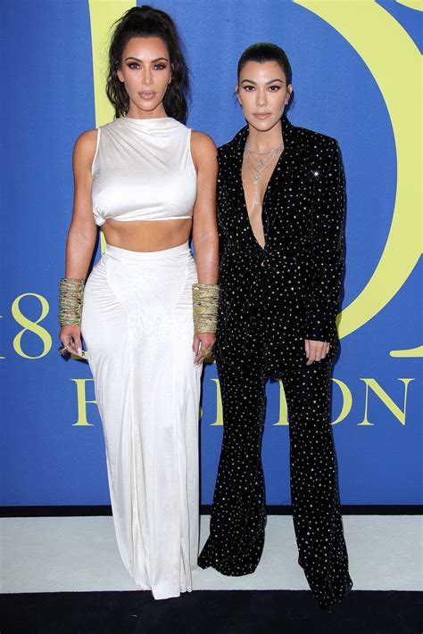 kourtney kardashian supports sister kim in a plunging pantsuit at the cfda awards kourtney