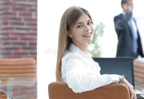 Rear Viewfemale Assistant Looking At The Camera Stock Image Image