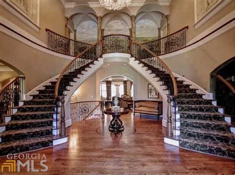 The railing is the diagonal handrail that you hold on to when climbing or descending stairs. 12,000 Square Foot Newly Listed Brick & Stone Mansion In Woodstock, GA | Homes of the Rich - The ...