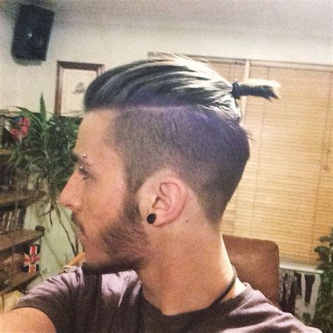 The top knot hairstyle is a perfect choice for men with long hair, preferably those that stretch to the shoulders #1 curly top knot with low skin fade. Undercut - tied up | Man bun hairstyles, Top knot ...