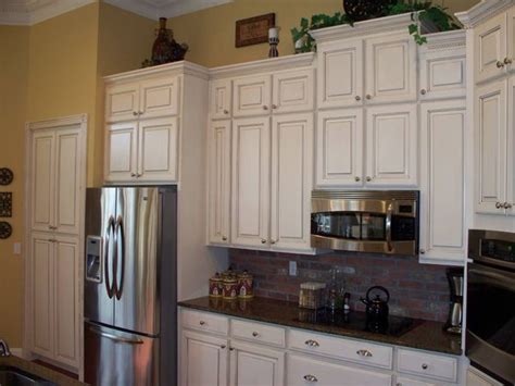 If you want to refinish your oak cabinets but you do not want to go to the extra effort of filling in the grain, go for a solid color that won't show off the grain as much. Click to View before and after - this kitchen had the ...