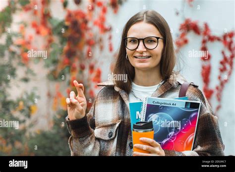 Happy Caucasian Student Girl Keeping Fingers Crossed For Luck Making