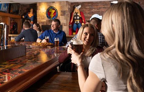 Superheroes, Villains Collide with Pizza in Comic Book Café