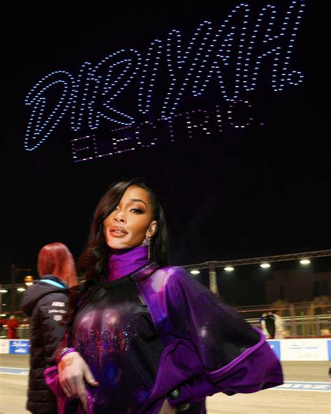 Winnie Harlow Stuns In Purple Themed Outfit At Formula E World